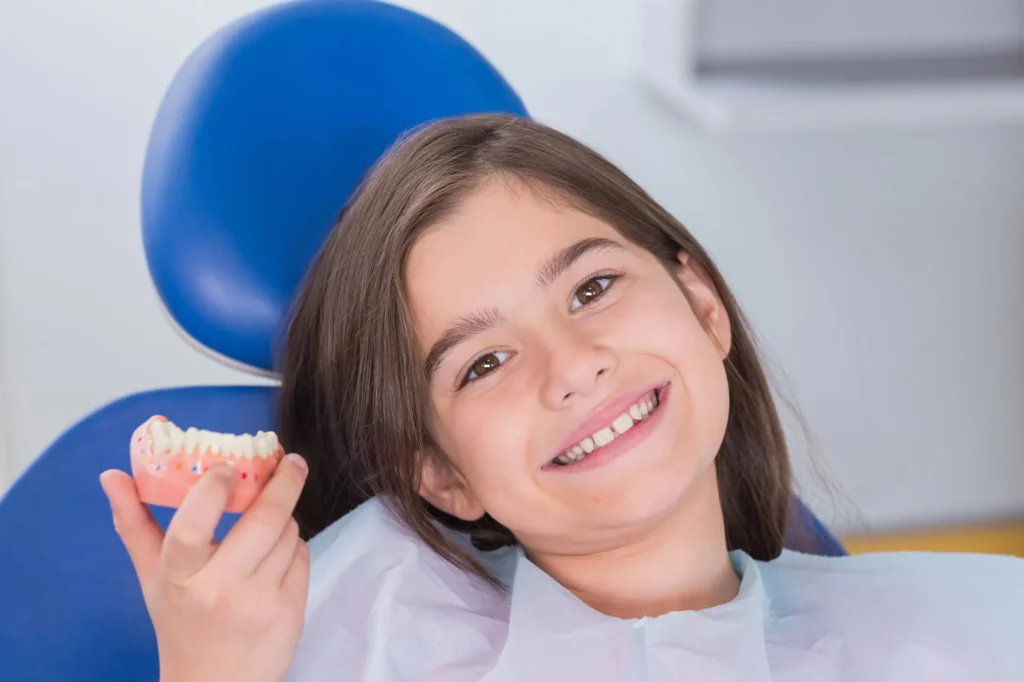 patient smiling at pediatric dentist moody al