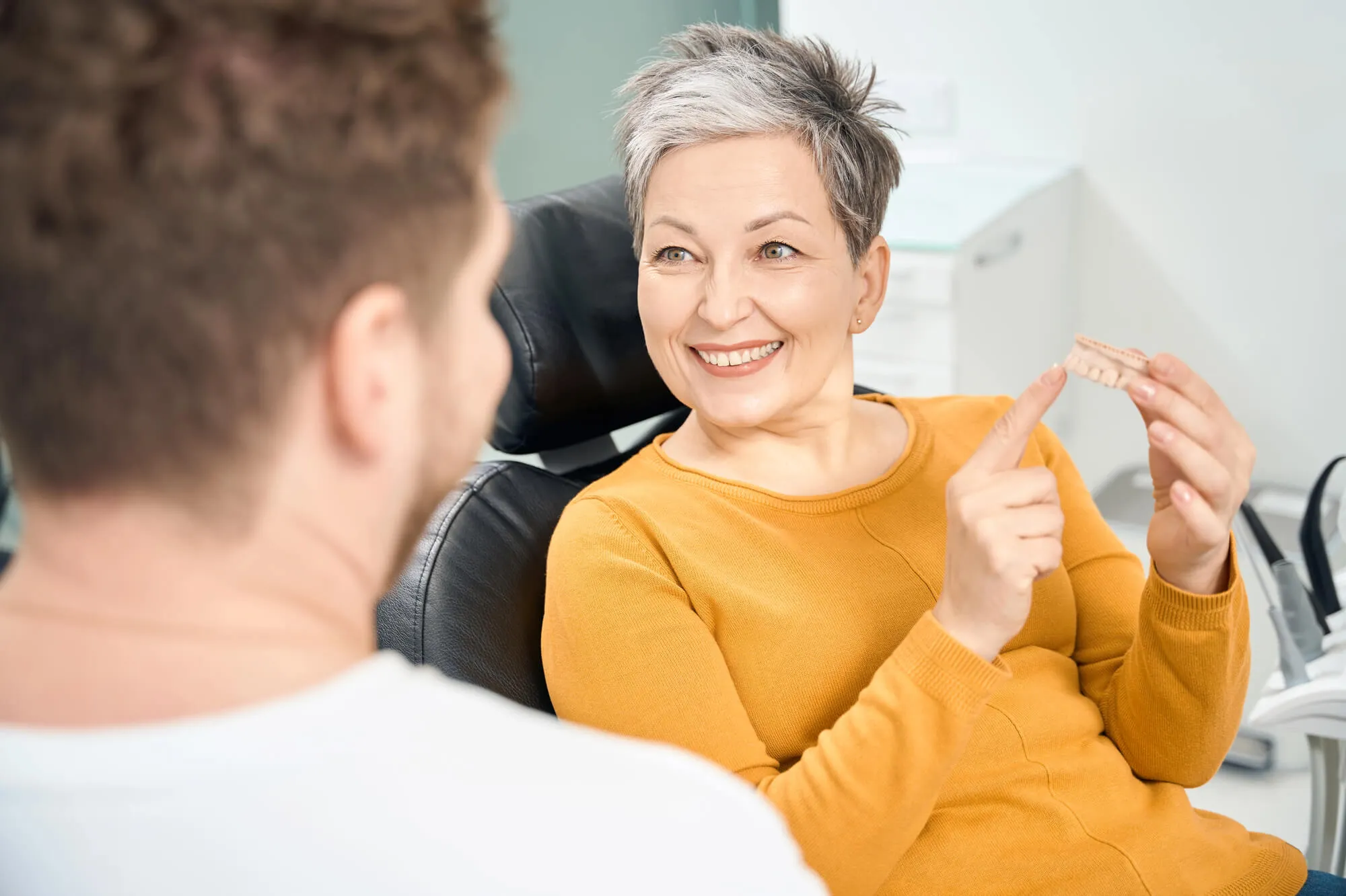 dentist in st. clair county answering patient's questions